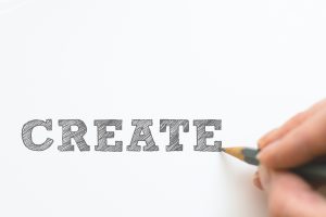 A person writing with a pencil -create